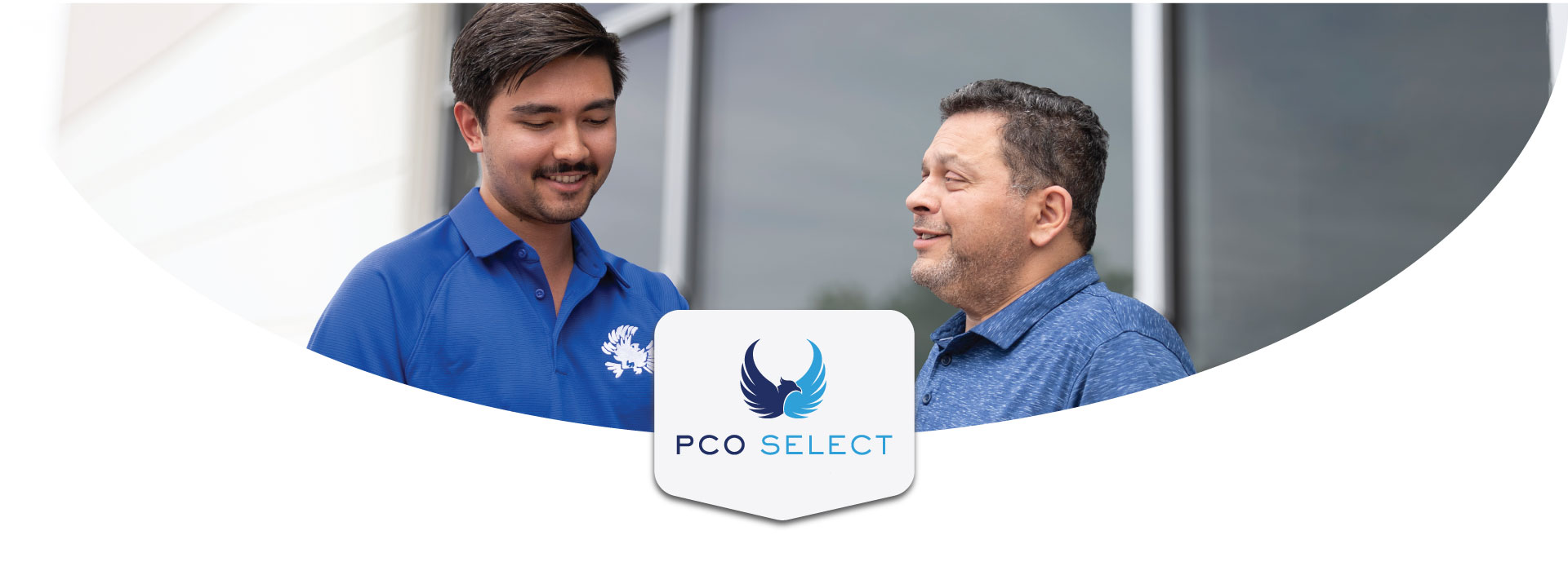 pest control professional wearing blue shirt consulting with business owner