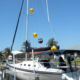 scare eyes balloon hanging on sailboat mast