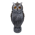 A realistic owl decoy with detailed black and white feathering, designed for pest control. The decorative sculpture features amber-colored reflective gemstone eyes, a textured body, and an eyelet at the top for hanging. This predator replica stands upright in a natural perched position and is crafted to deter birds, rodents, and other garden pests.